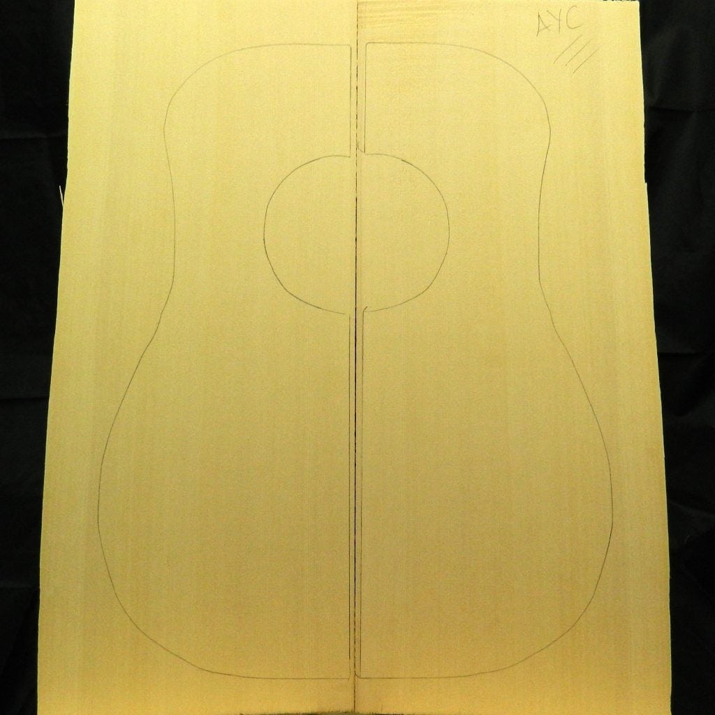 Bookmatched AAA yellow Cedar dread soundboard with guitar body outline and AYC mark.