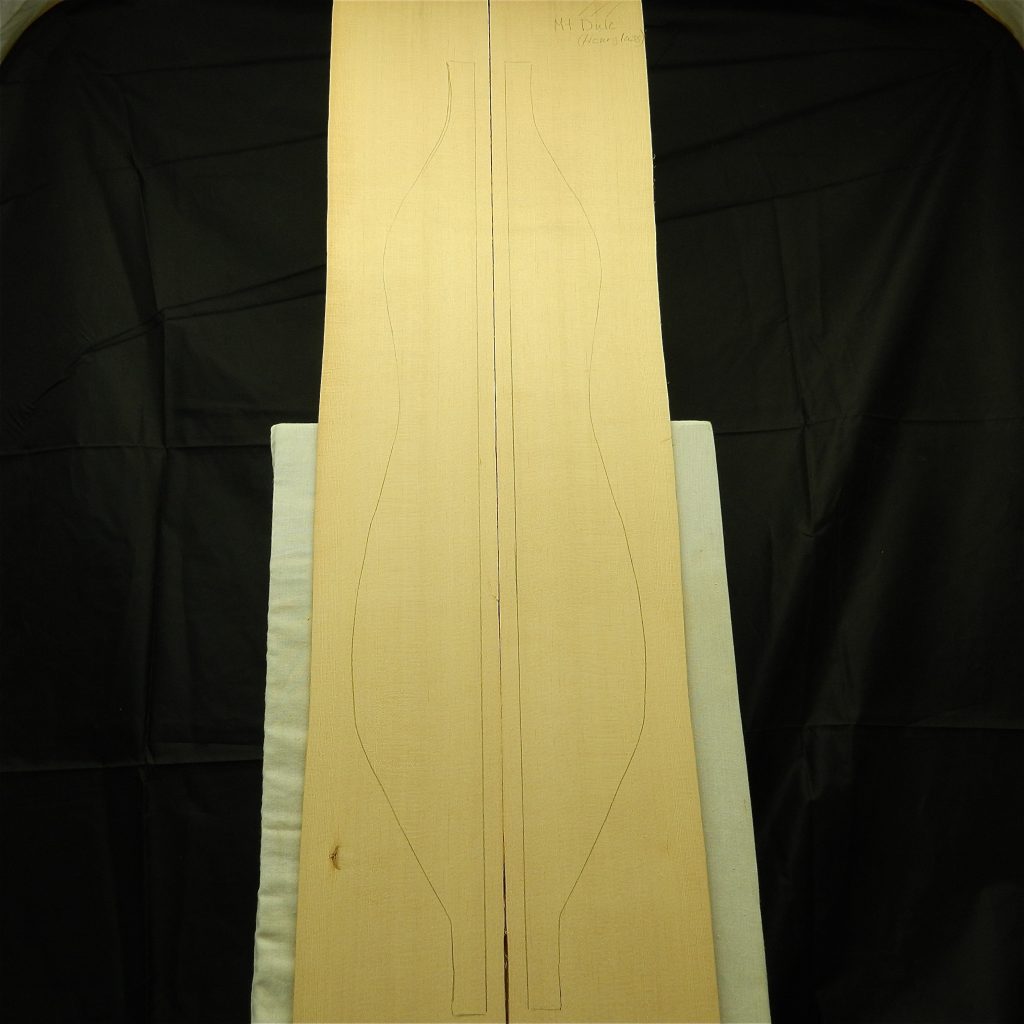 Bookmatched AAA Sitka Spruce Mountain Dulcimer tonewood pieces with instrument outline guides.