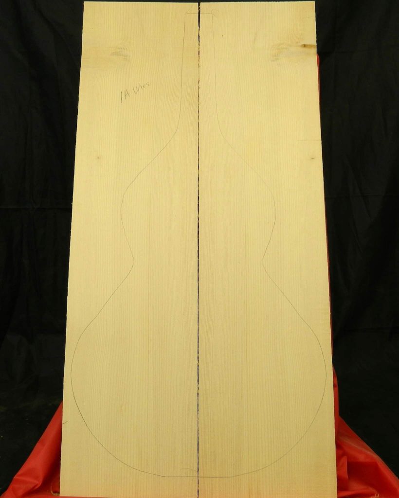 A-Grade Sitka Weissenborn top set joined with guitar body outline for luthier crafting.