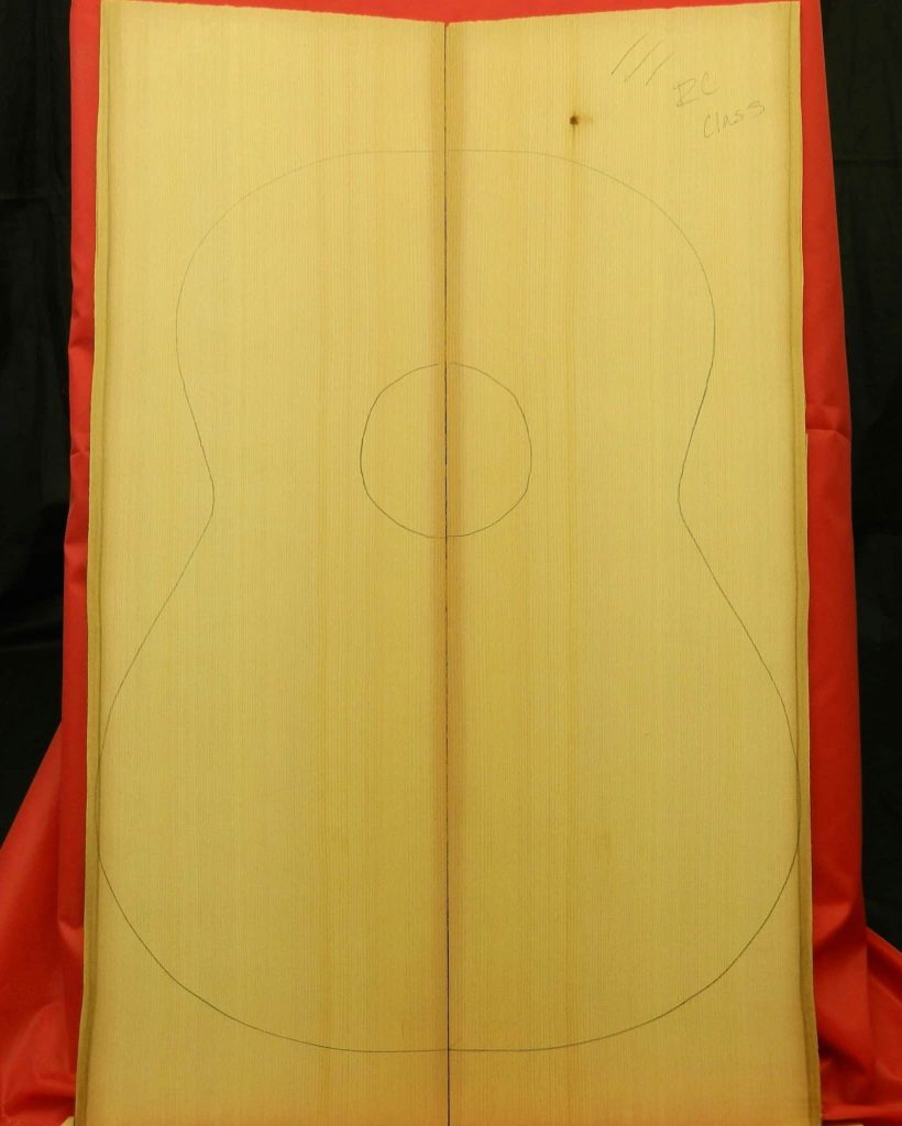 Bookmatched AAA Classical Western Red Cedar set guitar top with body outline and soundhole template.