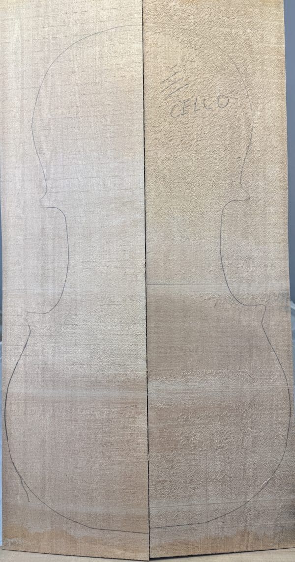 Book-matched AAA Sitka Spruce Cello Front with cello body outline.
