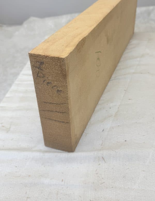 Light brown wooden billet for flat top mandolins with natural grain and identifying marks.